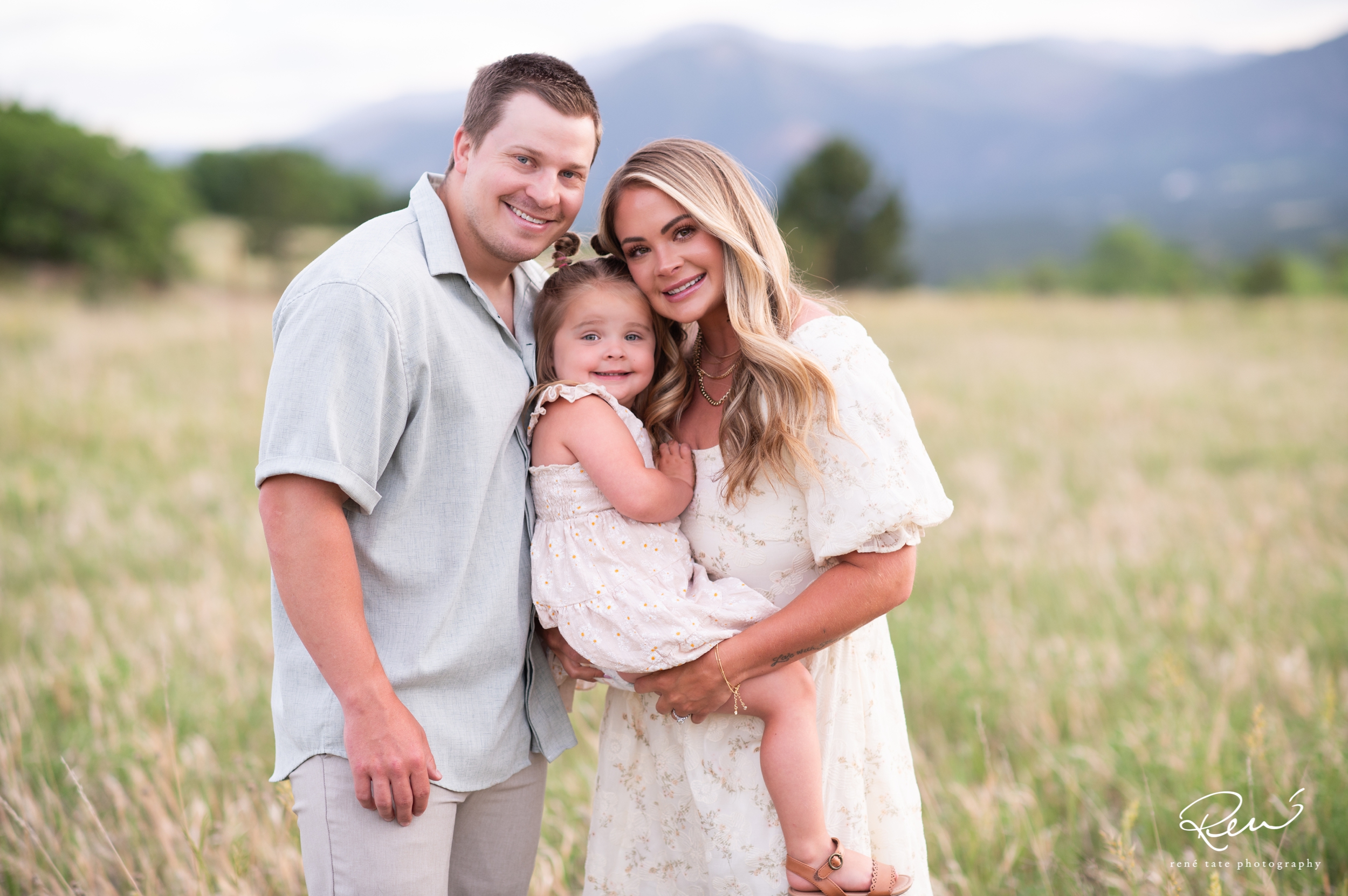 Family of four posing together during an extended family photography session in Northgate, Colorado Springs.