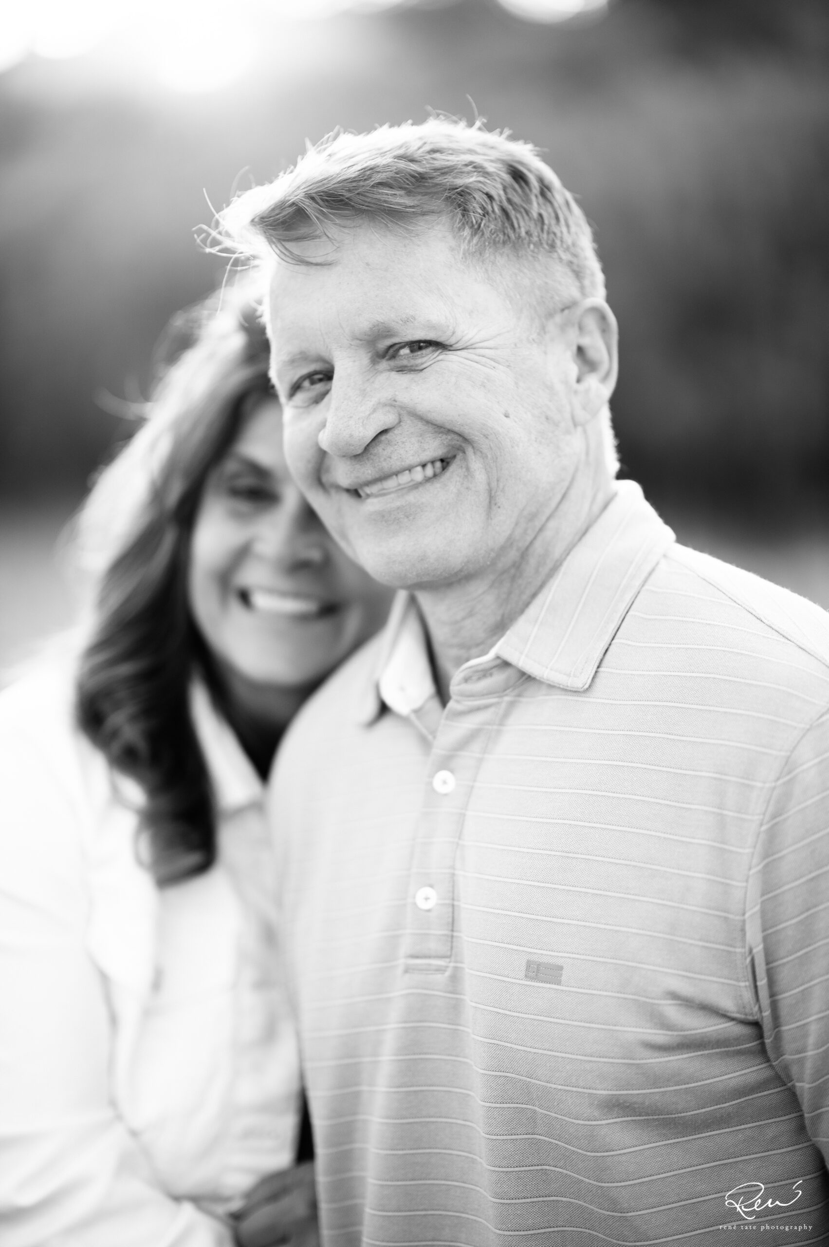 Candid family interaction during a multigenerational family photo session in Colorado Springs, Colorado.